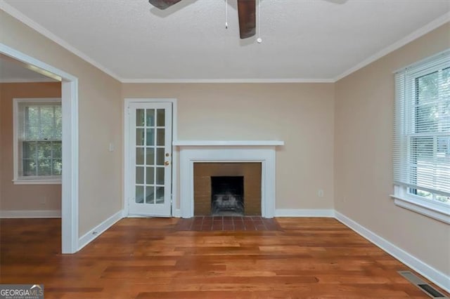 unfurnished living room featuring ornamental molding, hardwood / wood-style flooring, and ceiling fan