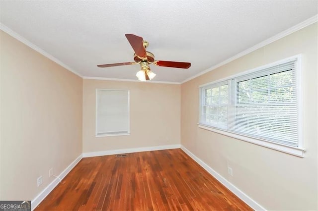 empty room with crown molding, a textured ceiling, ceiling fan, and dark hardwood / wood-style flooring