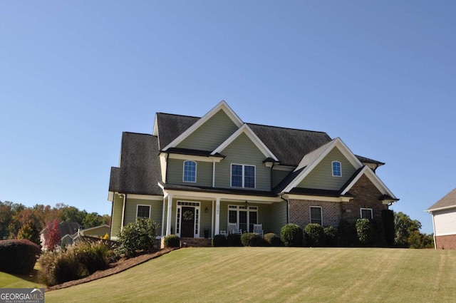 craftsman inspired home with a front yard