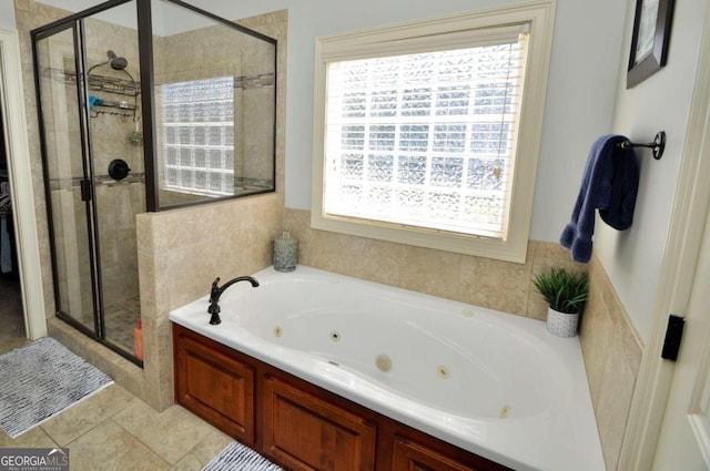 bathroom with separate shower and tub, tile patterned flooring, and plenty of natural light