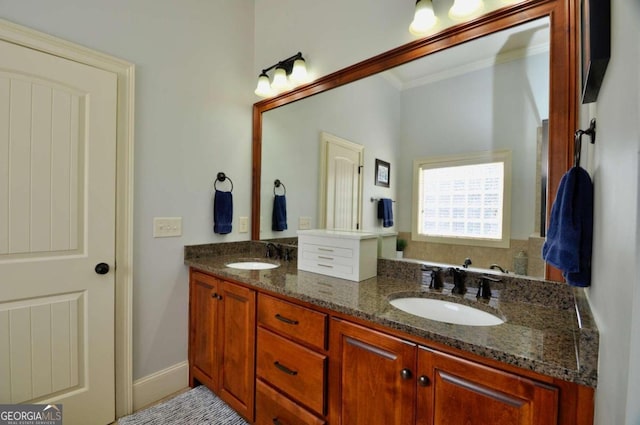 bathroom featuring vanity and ornamental molding