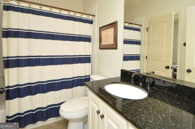 bathroom featuring vanity, curtained shower, toilet, and tile patterned floors