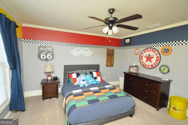 carpeted bedroom featuring crown molding and ceiling fan