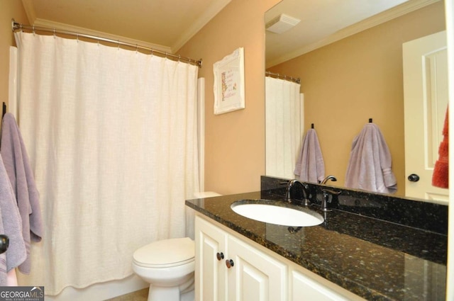 bathroom with vanity, crown molding, and toilet