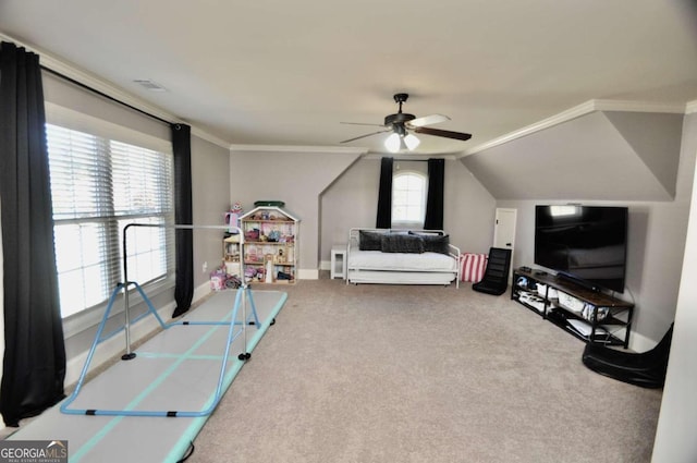 carpeted bedroom featuring crown molding and ceiling fan