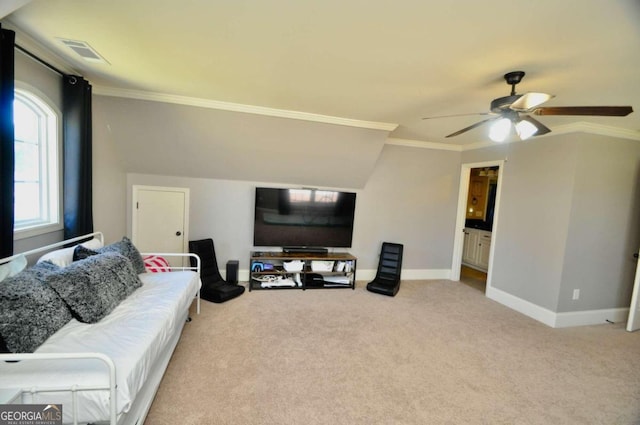 living room featuring ornamental molding, light colored carpet, and ceiling fan