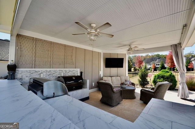 view of patio / terrace featuring area for grilling, outdoor lounge area, and ceiling fan