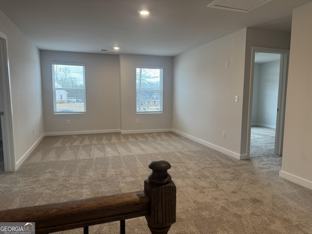 carpeted empty room with a healthy amount of sunlight