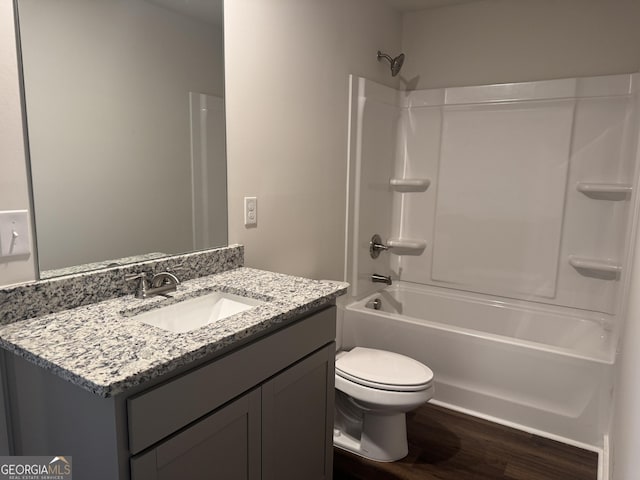 full bathroom with toilet, shower / bath combination, wood-type flooring, and vanity