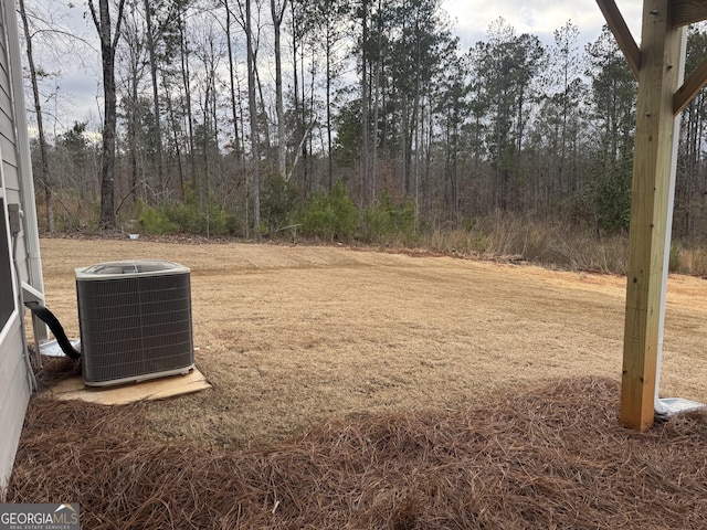 view of yard with central air condition unit