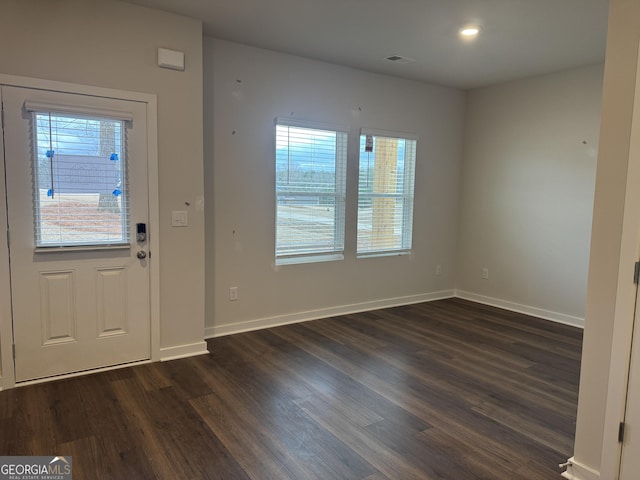 foyer with dark hardwood / wood-style floors