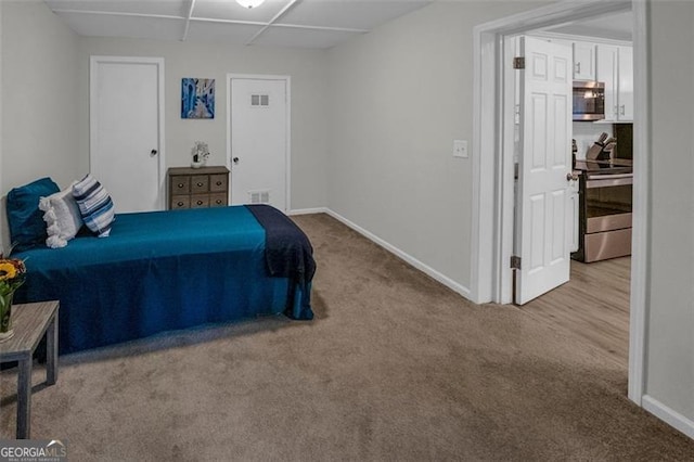 bedroom with light colored carpet