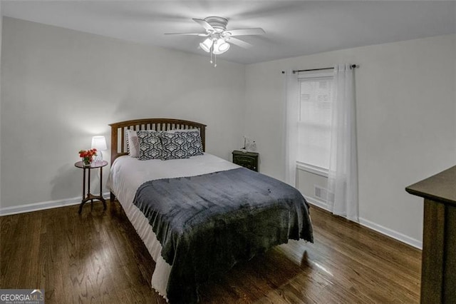 bedroom featuring dark hardwood / wood-style flooring and ceiling fan