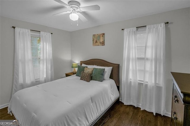 bedroom featuring ceiling fan and dark hardwood / wood-style flooring