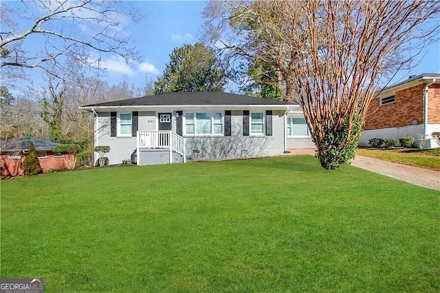 ranch-style house with a front lawn