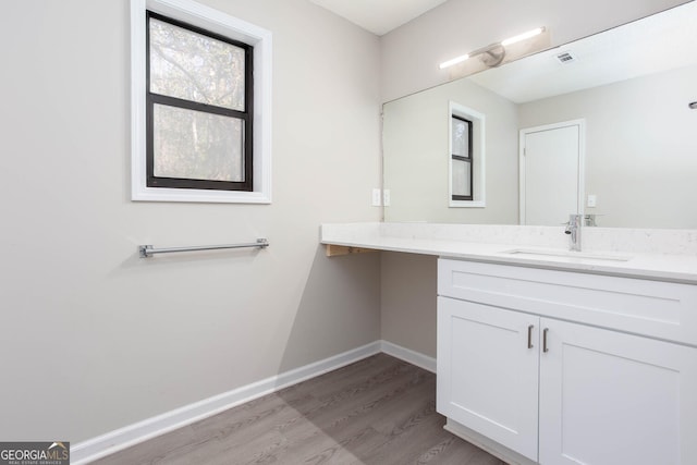 bathroom featuring hardwood / wood-style floors and vanity