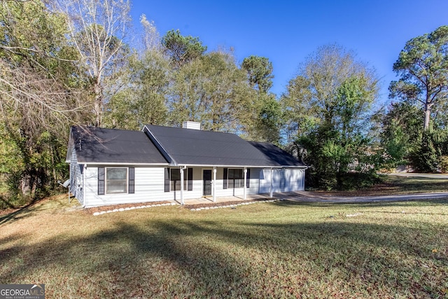 view of front of home with covered porch and a front yard