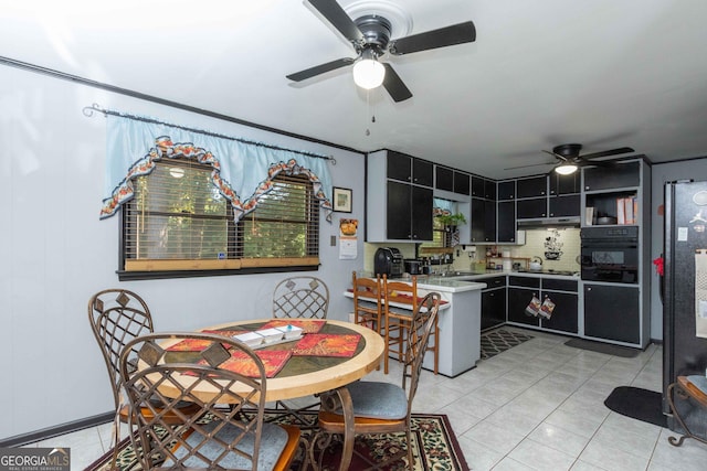 kitchen with ceiling fan, backsplash, stainless steel gas cooktop, and sink