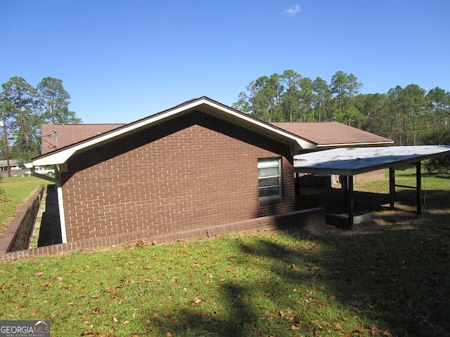 view of home's exterior with a yard