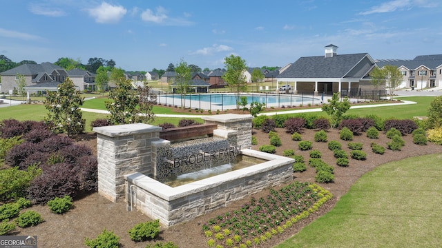 view of swimming pool with a gazebo and a yard