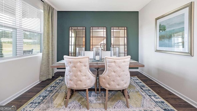 dining space with dark hardwood / wood-style flooring