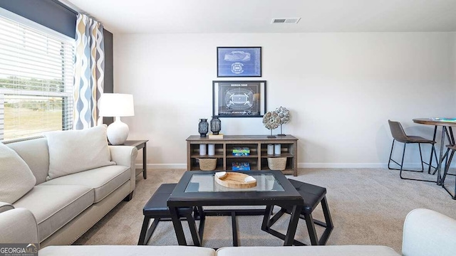 living room featuring light colored carpet