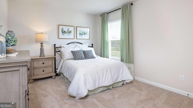 bedroom featuring light colored carpet