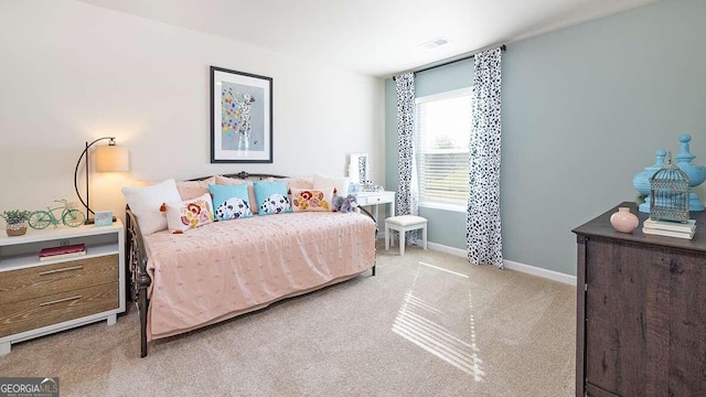 bedroom featuring light colored carpet