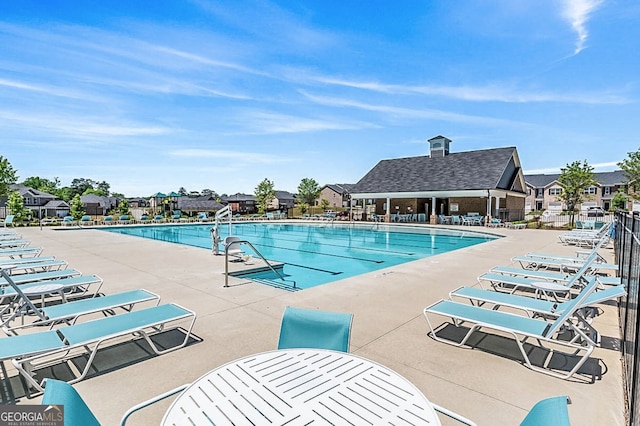 view of swimming pool with a patio area