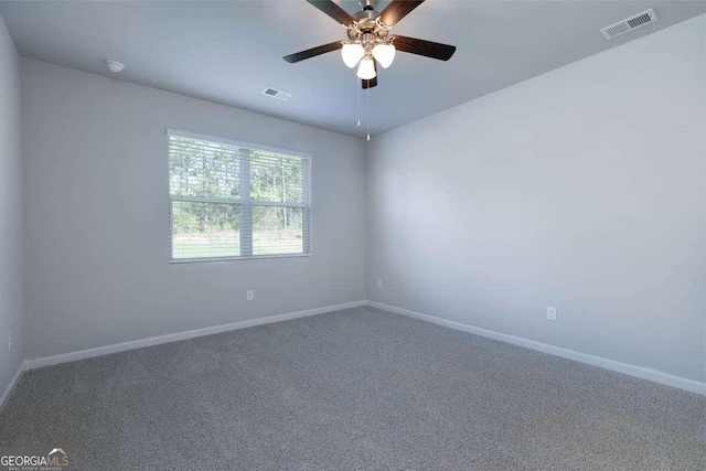 unfurnished room with carpet and ceiling fan