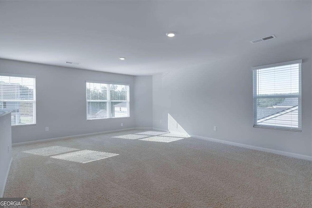 unfurnished room with carpet floors