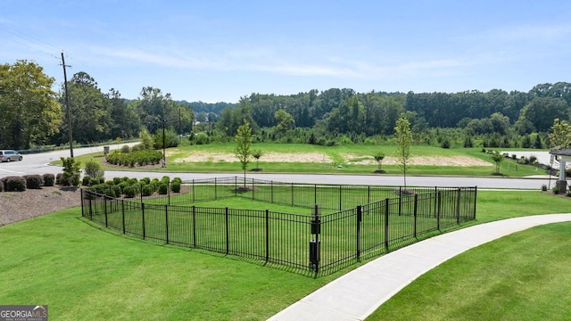 view of sport court featuring a yard