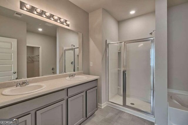 bathroom featuring vanity and walk in shower