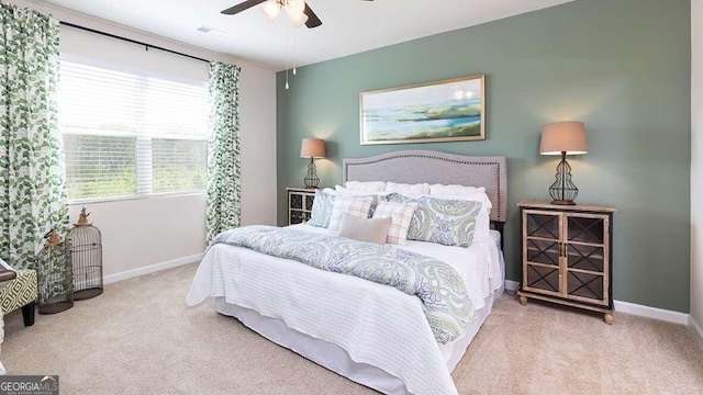 carpeted bedroom featuring ceiling fan