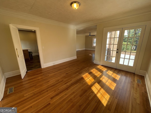 interior space featuring french doors, a textured ceiling, dark hardwood / wood-style flooring, ceiling fan, and ornamental molding