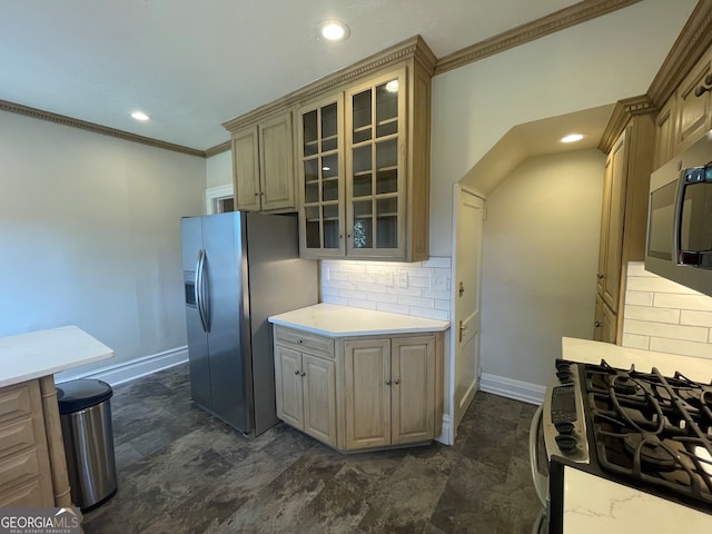kitchen featuring ornamental molding, appliances with stainless steel finishes, and tasteful backsplash