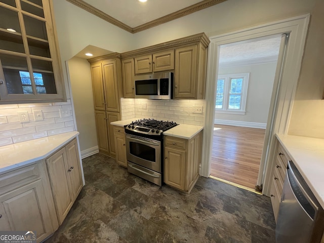 kitchen featuring ornamental molding, appliances with stainless steel finishes, dark hardwood / wood-style floors, and tasteful backsplash