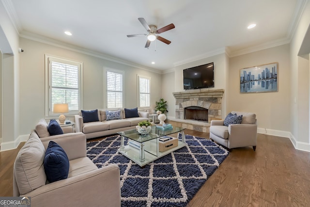 living room featuring hardwood / wood-style flooring, crown molding, and a wealth of natural light