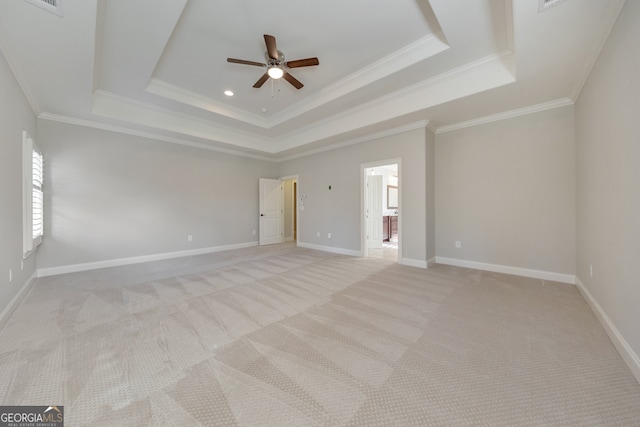 unfurnished room featuring ceiling fan, light colored carpet, and crown molding