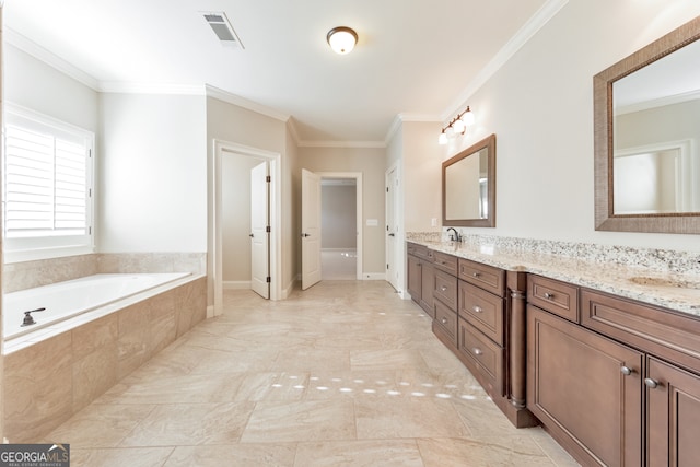 bathroom featuring tiled bath, vanity, and ornamental molding