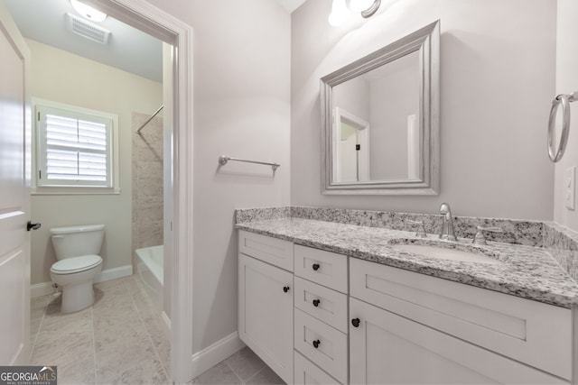 full bathroom with vanity, toilet, and tiled shower / bath