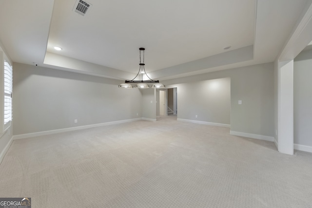 interior space with a tray ceiling