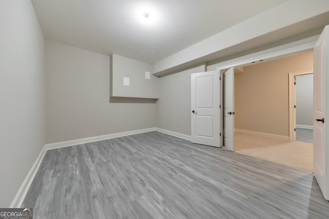 basement with light wood-type flooring