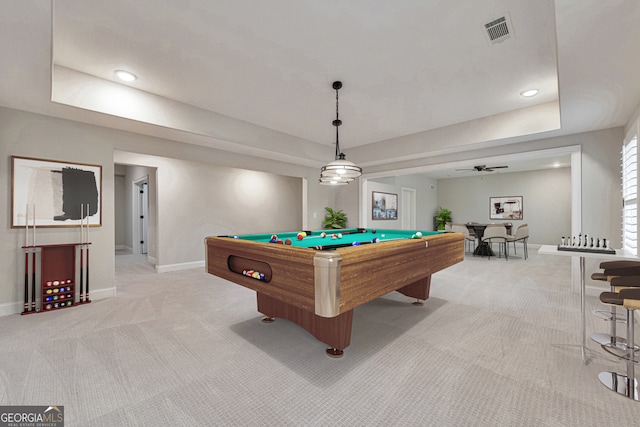 game room with a raised ceiling, light carpet, ceiling fan, and pool table