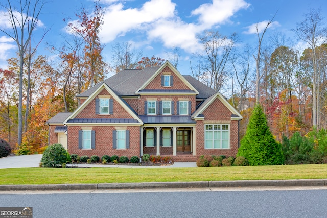 craftsman-style house featuring a front lawn