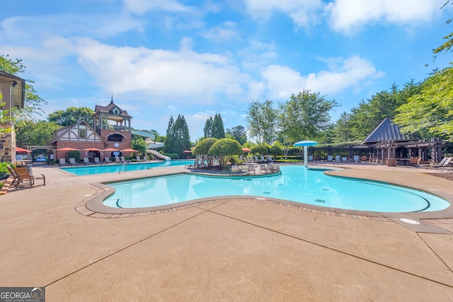 view of swimming pool with a patio area