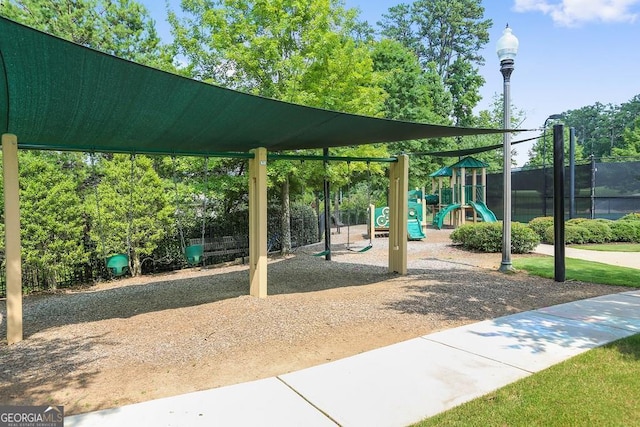 view of property's community with a playground