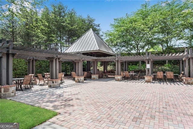 view of home's community featuring a pergola and a patio area