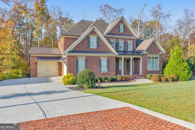 craftsman house featuring a front lawn and a garage