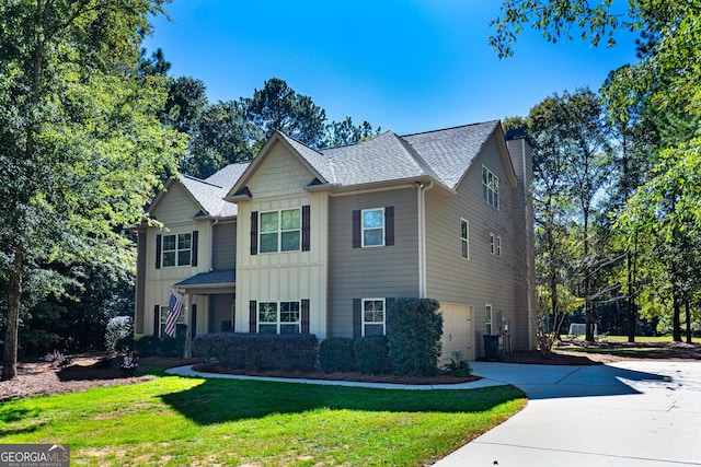 view of front facade featuring a garage and a front yard